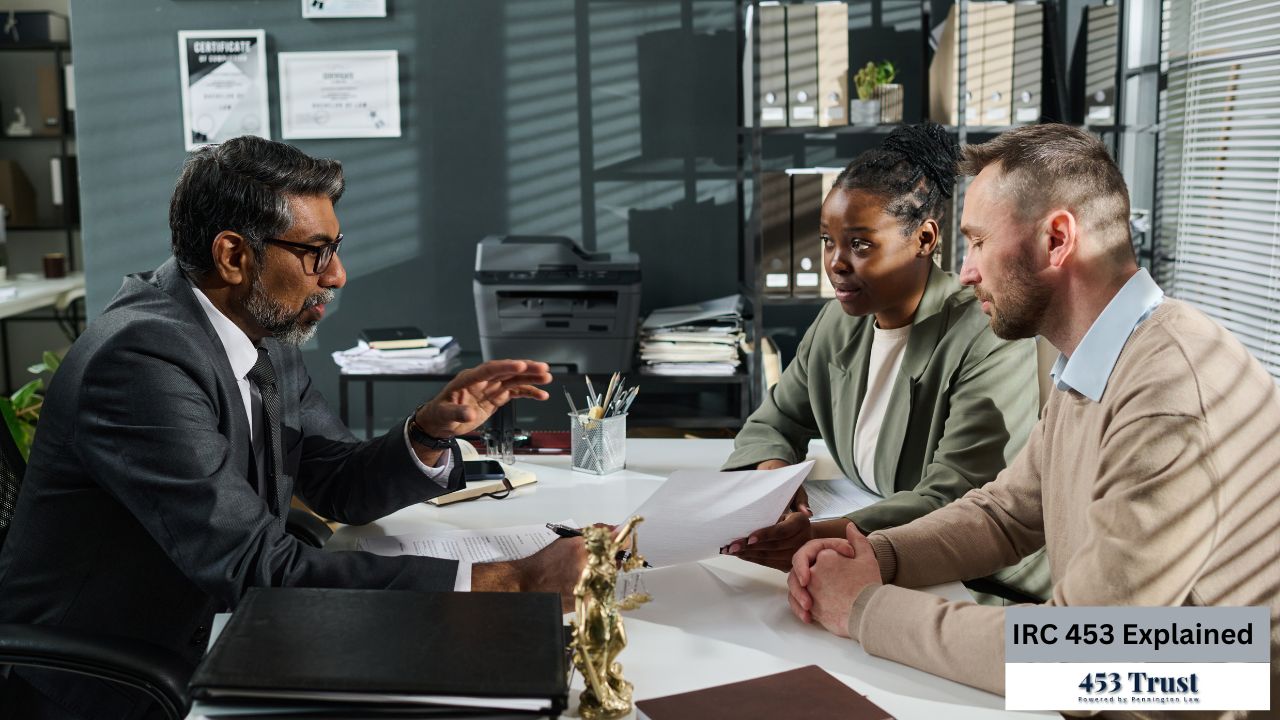 A legal professional is in a meeting with a couple, likely discussing legal matters related to trusts or financial planning.