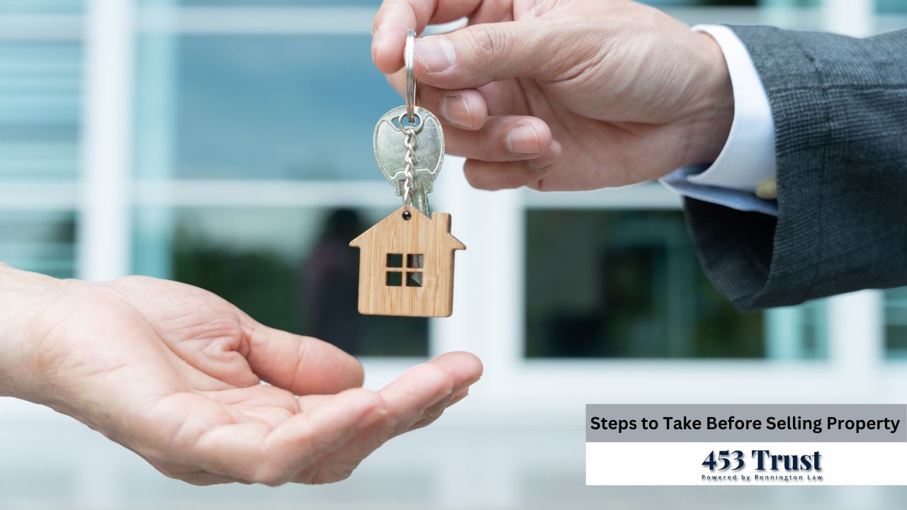 A person in a suit hands over house keys to another person, symbolizing a property transaction, against a blurred background of a modern building.